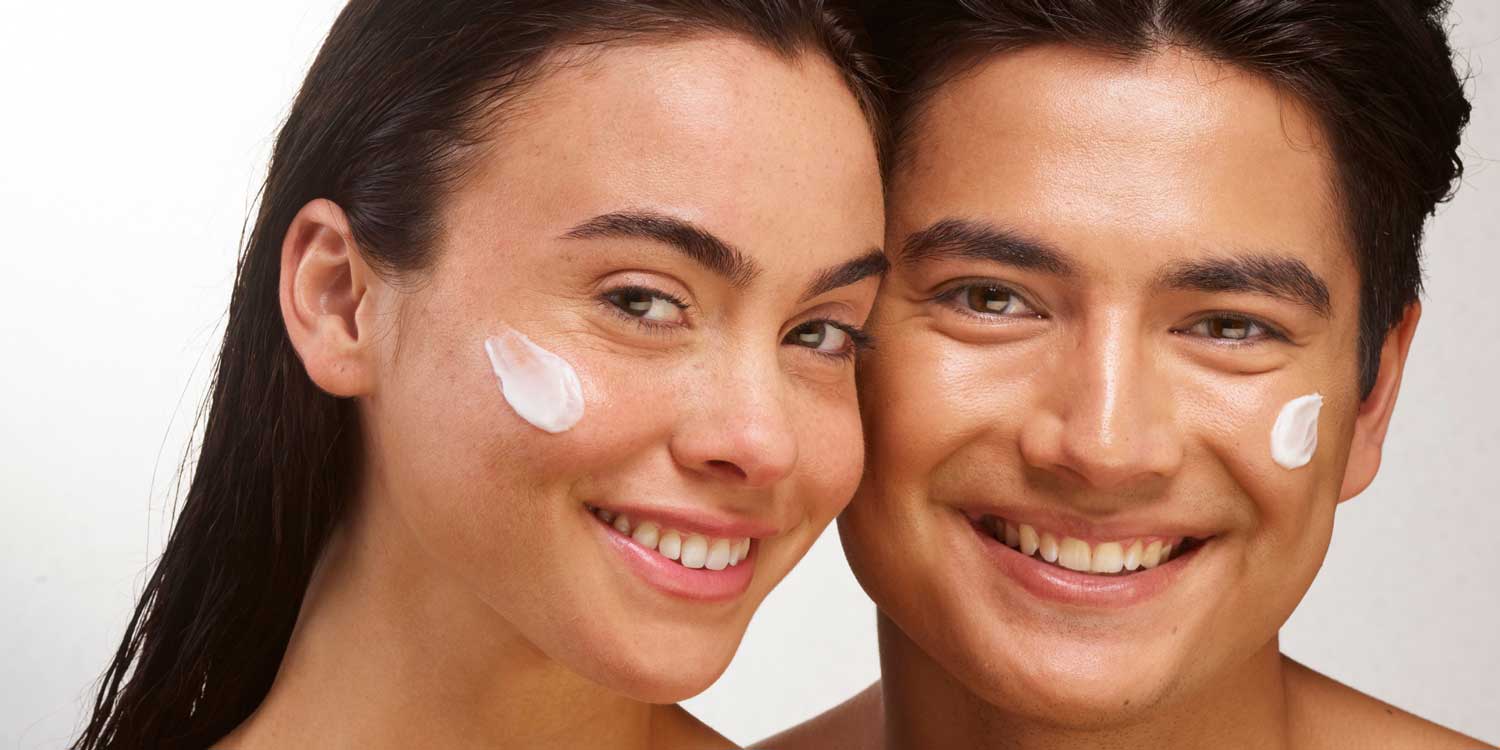 Couple using LightWater Skin Nutrition lotion and cream