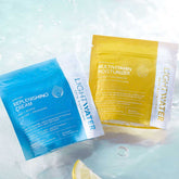 LightWater Fresh Daily Duo - Multivitamin Moisturizer + Replenishing Cream floating in water with slice of lemon peeking out 